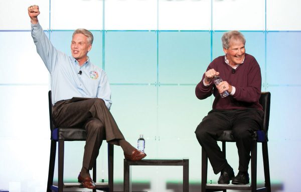 Brad D. Smith joins William Campbell on stage at an internal Intuit conference.