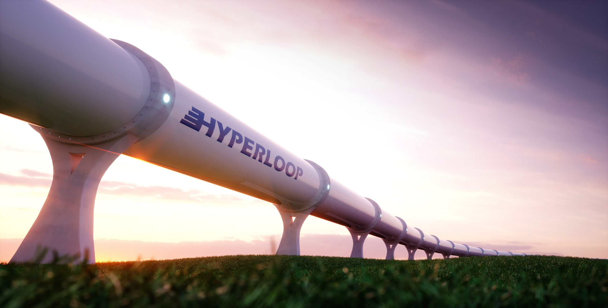 Hyperloop pipe over field of grass