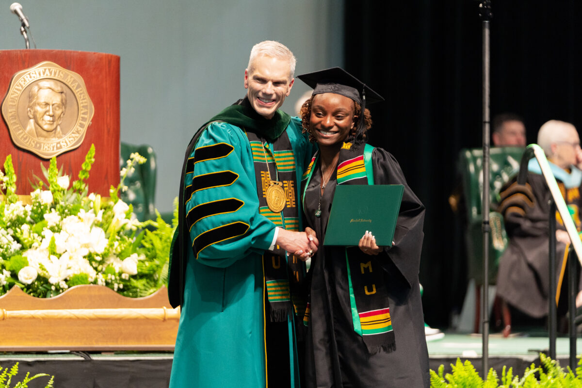 President Brad D. Smith congratulating a graduate at Marshall University’s 2023 Spring Commencement.