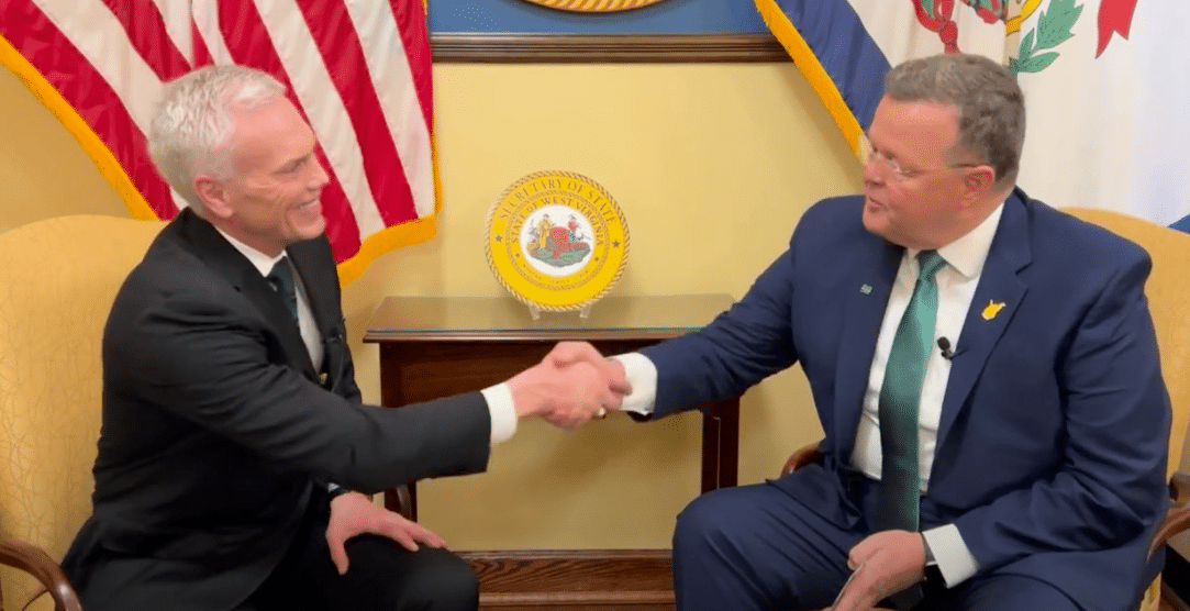 President Brad D. Smith shakes hands with Secretary of State Kris Warner, concluding his “Just Three Questions” interview.