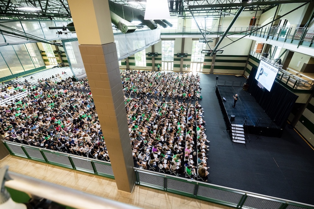 Aerial shot of Marshall’s Week of Welcome 2025 showing students facing a podium where President Brad D. Smith is speaking to them